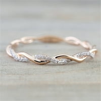 Dijamantni zaručnički prsten uvijenog oblika koji se uklapa u odgovarajući bend, jubilarni prsten